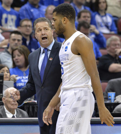 Coach John Calipari talks to Andrew Harrison earlier in the tournament. (AP)