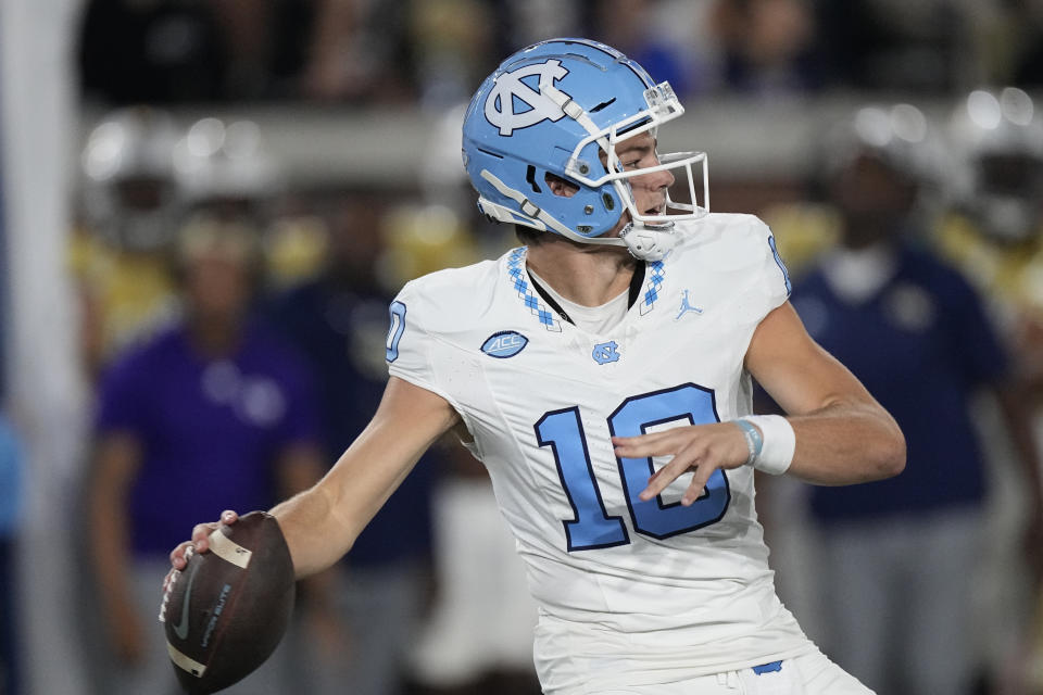 North Carolina quarterback Drake Maye (10) throws deep against Georgia Tech during the first half of an NCAA college football game, Saturday, Oct. 28, 2023, in Atlanta. (AP Photo/John Bzemore)