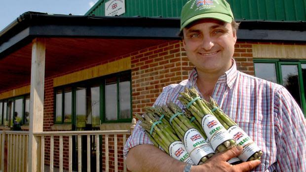 Eastern Daily Press: Andy Allen with some of his asparagus at his farm shop at Portwood Farm, Great Ellingham