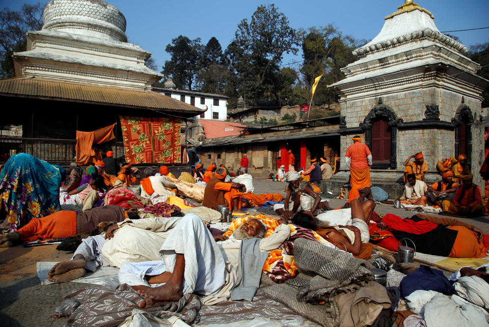 <p>Hindu holy men, or sadhus, ease at the premises of Pashupatinath Temple, ahead of the Shivaratri festival in Kathmandu, Nepal, Feb. 22, 2017. REUTERS/Navesh Chitrakar </p>