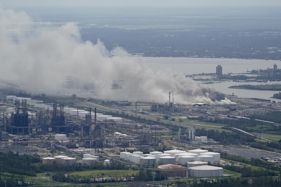 A chemical fire burns at a facility during the aftermath of Hurricane Laura Thursday, Aug. 27, 2020, near Lake Charles, La. (AP Photo/David J. Phillip)