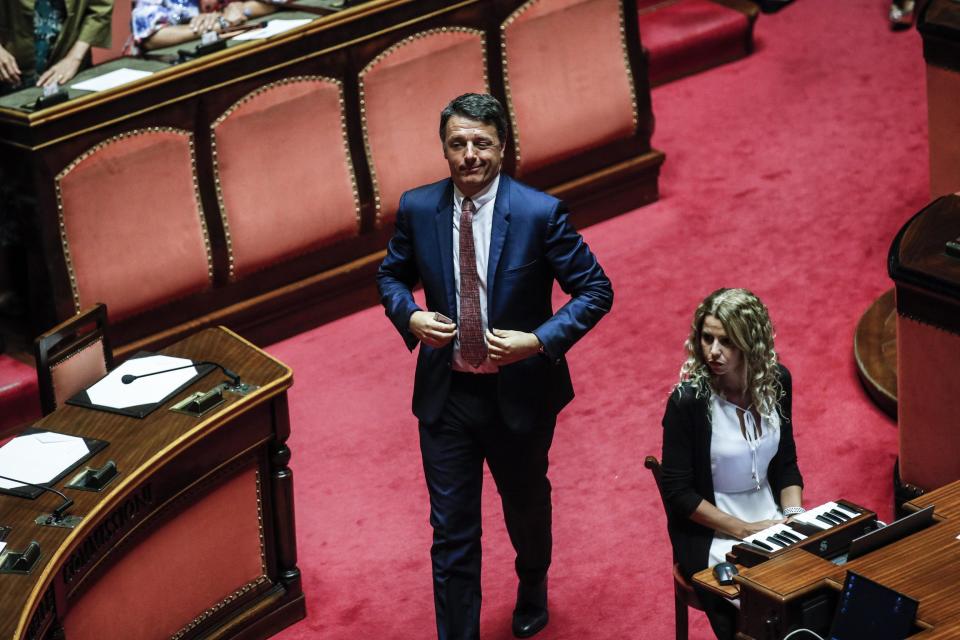 Former Italian premier Matteo Renzi arrives for a session at the Senate in Rome, Tuesday, Aug. 13, 2019. Italy’s political leaders were scrambling to line up allies and alliances Tuesday as Matteo Salvini pressed his demands for early elections as soon as possible in the hope of snagging the premiership with his anti-migrant, Euro-skeptic agenda. Hastily summoned back from a vacation break, the Senate was convened to vote later Tuesday on when to schedule a no-confidence motion lodged by Salvini’s right-wing League party against Premier Giuseppe Conte’s 14-month old populist government. (Giuseppe Lami/ANSA via AP)