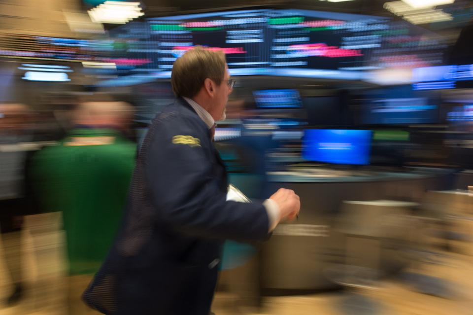 A trader runs across the floor after the closing bell at the New York Stock Exchange, Feb. 21, 2017 in New York.