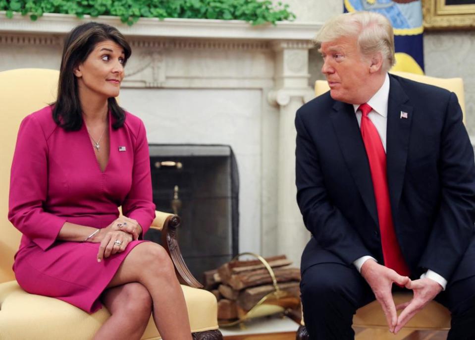 President Donald Trump talks with Haley, then his UN ambassador in the Oval Office of the White House after it was announced the president had accepted the Haley’s resignation on 9 October 2018.