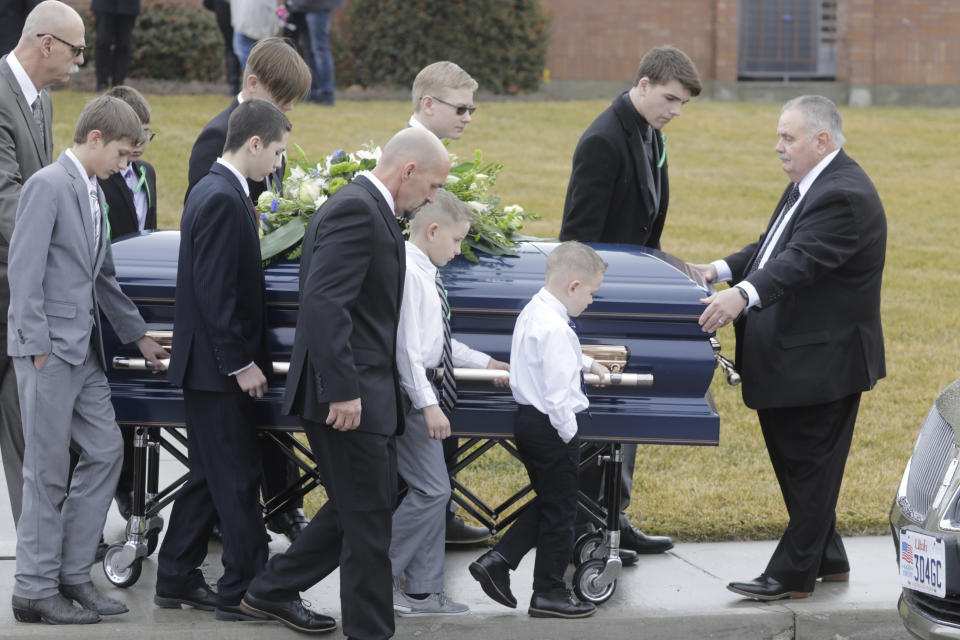 Pallbearers carry a casket following the funeral services for Consuelo Alejandra Haynie, daughters 12-year-old Milan and 15-year-old Alexis and 14-year-old son Matthew Friday, Jan. 24, 2020, in Grantsville, Utah. The killing of a Utah mother and three of her children by a gunman identified by police as her 16-year-old son is "nearly unbearable" for the father who survived, a lawyer said Thursday, Jan. 23, 2020.(AP Photo/Rick Bowmer)