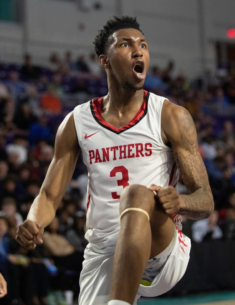 Justin Edwards of Imhotep Charter celebrates after a dunk against Christopher Columbus in the City of Palms Classic Championship game on Wednesday, Dec. 21, 2022, at Suncoast Credit Union Arena in Fort Myers.