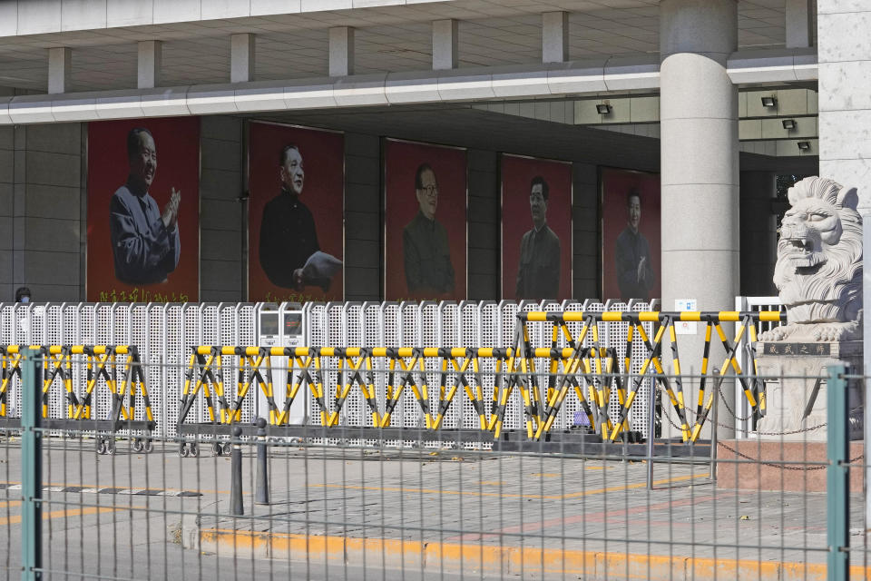 Portraits of China's former top leaders from left Mao Zedong, Deng Xiaoping, Jiang Zemin, Hu Jintao and including the current President Xi Jinping are seen at a military camp in Beijing, China, Thursday, Nov. 11, 2021. China's leaders have approved a resolution on the history of the ruling Communist Party that was expected to set the stage for President Xi Jinping to extend his rule next year during a four-day meeting of its Central Committee that ended Thursday. (AP Photo/Ng Han Guan)