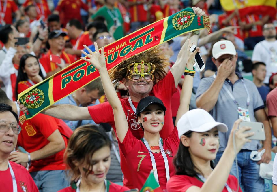 <p>Fans support their teams during the 2018 FIFA World Cup Russia Group B match between Portugal and Spain at the Fisht Stadium in Sochi, Russia on June 15, 2018. (Photo by Fatih Aktas/Anadolu Agency/Getty Images) </p>