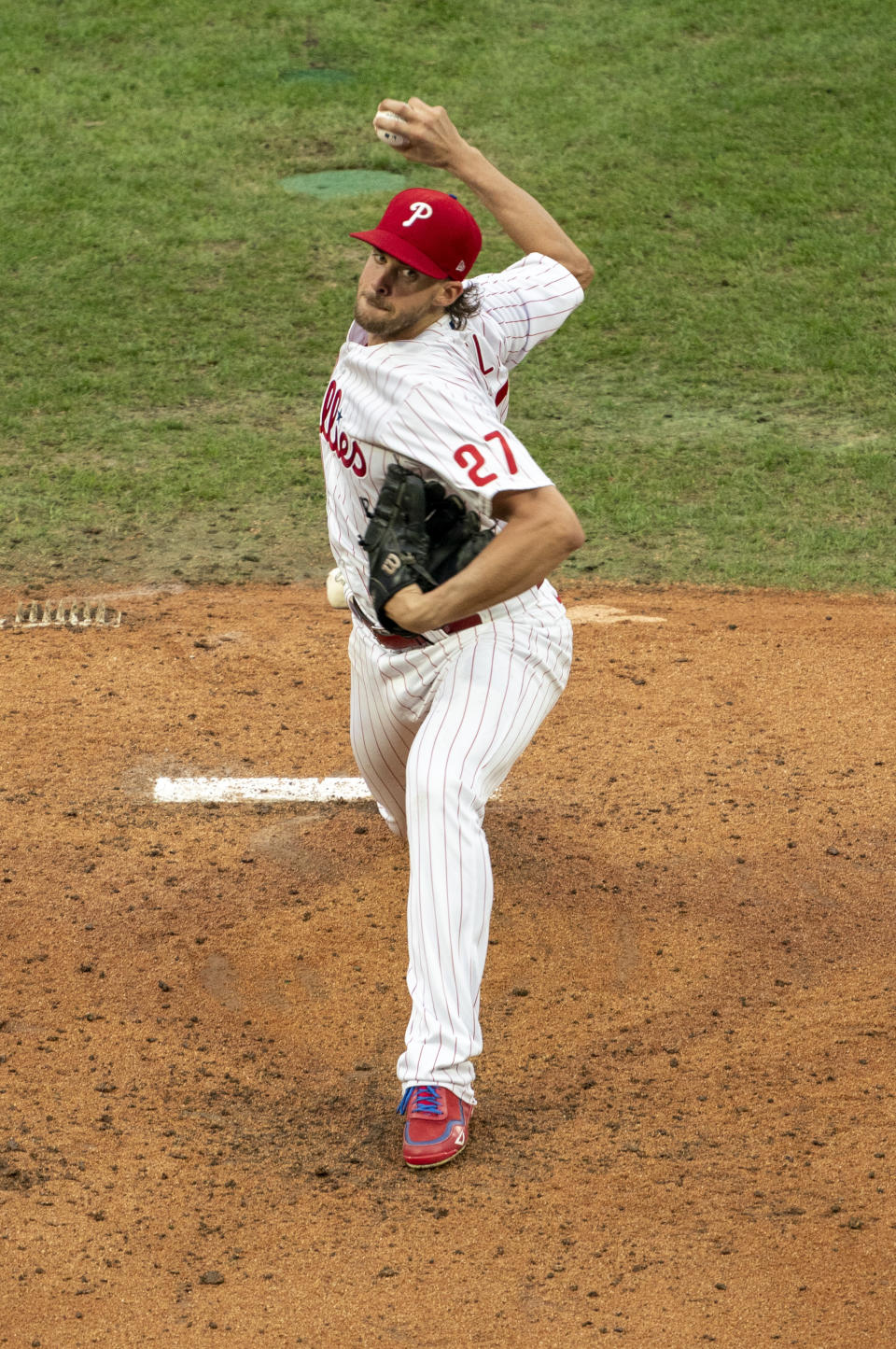 Philadelphia Phillies starting pitcher Aaron Nola throws a pitch during the third inning of a baseball game against the New York Mets, Saturday, Aug. 15, 2020, in Philadelphia. (AP Photo/Chris Szagola)
