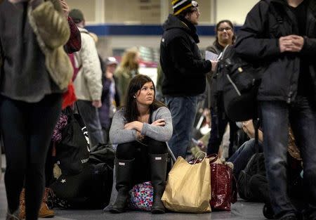 Holiday travellers wait for trains to be called at Penn Station in New York, November 26, 2014. REUTERS/Brendan McDermid