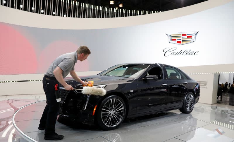 FILE PHOTO: A worker polishes a Cadillac CT6 V-Sport at the New York Auto Show in New York in 2018