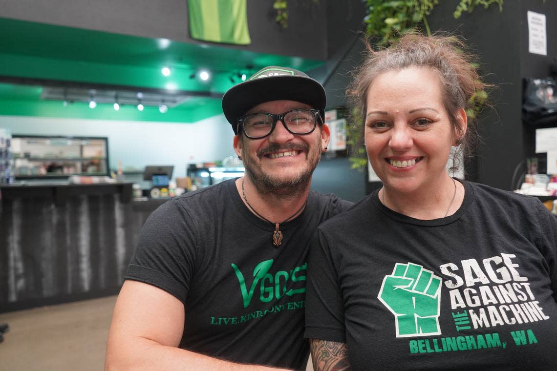 Nate Johnson, left, and Tara Folenius sit at a table in their co-owned restaurant, Sage Against the Machine, Wednesday, Oct. 12, in Bellingham.