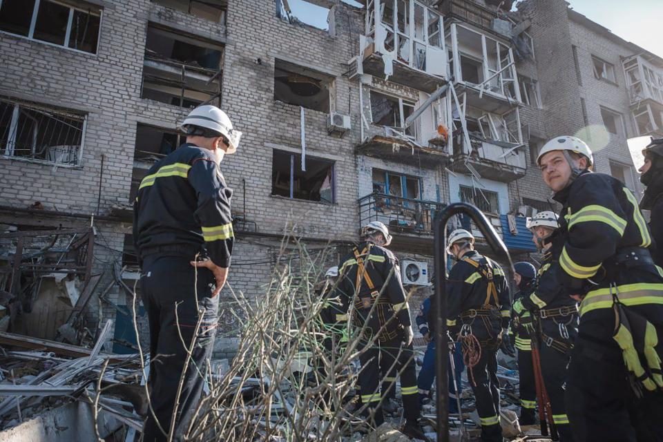 In this photo provided by the Ukrainian Emergency Service, rescuers work on the scene of a building damaged after Russian missile strikes in Pokrovsk, Donetsk region (AP)