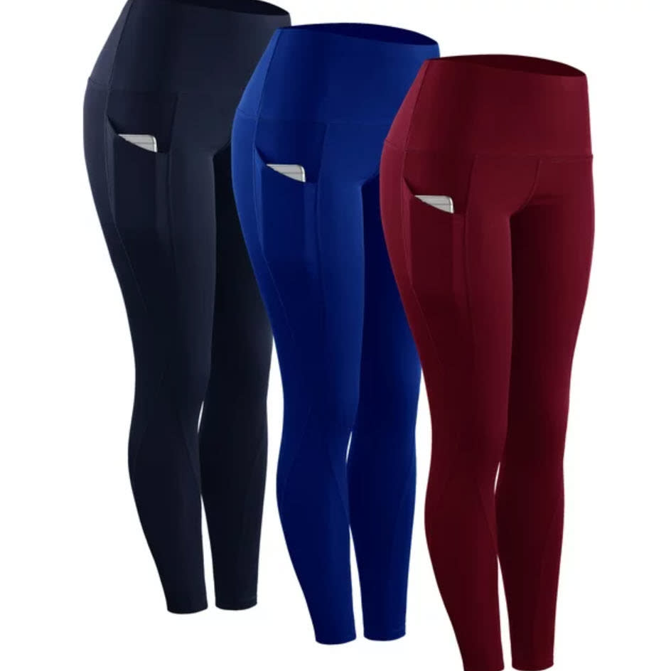 Three pairs of leggings in black, blue, and red displayed against a neutral backdrop. No people are in the image