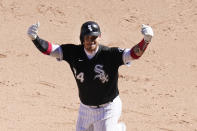 Chicago White Sox's Yasmani Grandal celebrates his game winning single during the 10th inning of a baseball game against the Tampa Bay Rays Wednesday, June 16, 2021, in Chicago. (AP Photo/Charles Rex Arbogast)