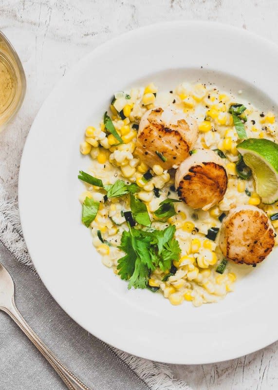 <p>Simply Recipes</p><p>Pan-seared scallops nestled in a bed of sweet corn and poblano chiles—perfect for sweet summer nights.</p><p><strong>Get the recipe: <a href="https://www.simplyrecipes.com/recipes/pan_seared_scallops_with_sweet_corn_and_chilies/" rel="nofollow noopener" target="_blank" data-ylk="slk:Pan-Seared Scallops with Sweet Corn and Chilies;elm:context_link;itc:0;sec:content-canvas" class="link ">Pan-Seared Scallops with Sweet Corn and Chilies</a></strong></p>