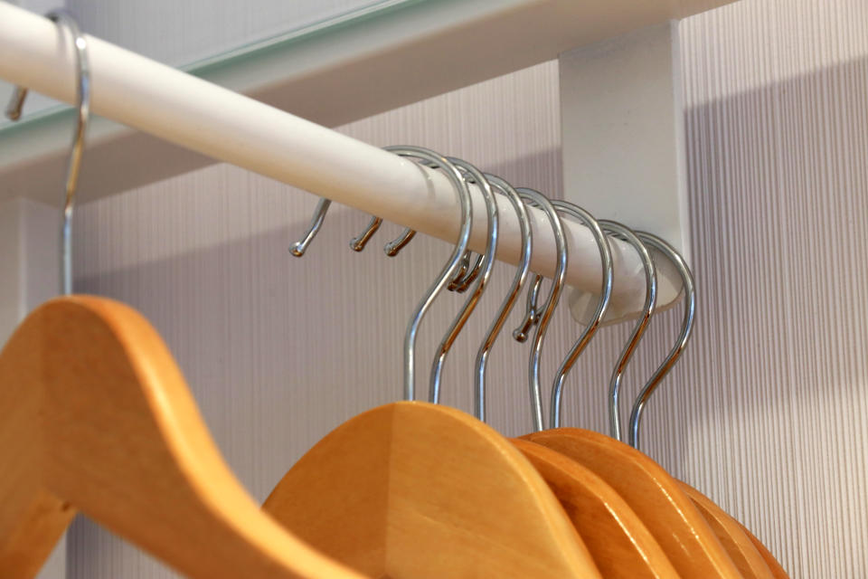 Wooden closet hangers in a hotel room