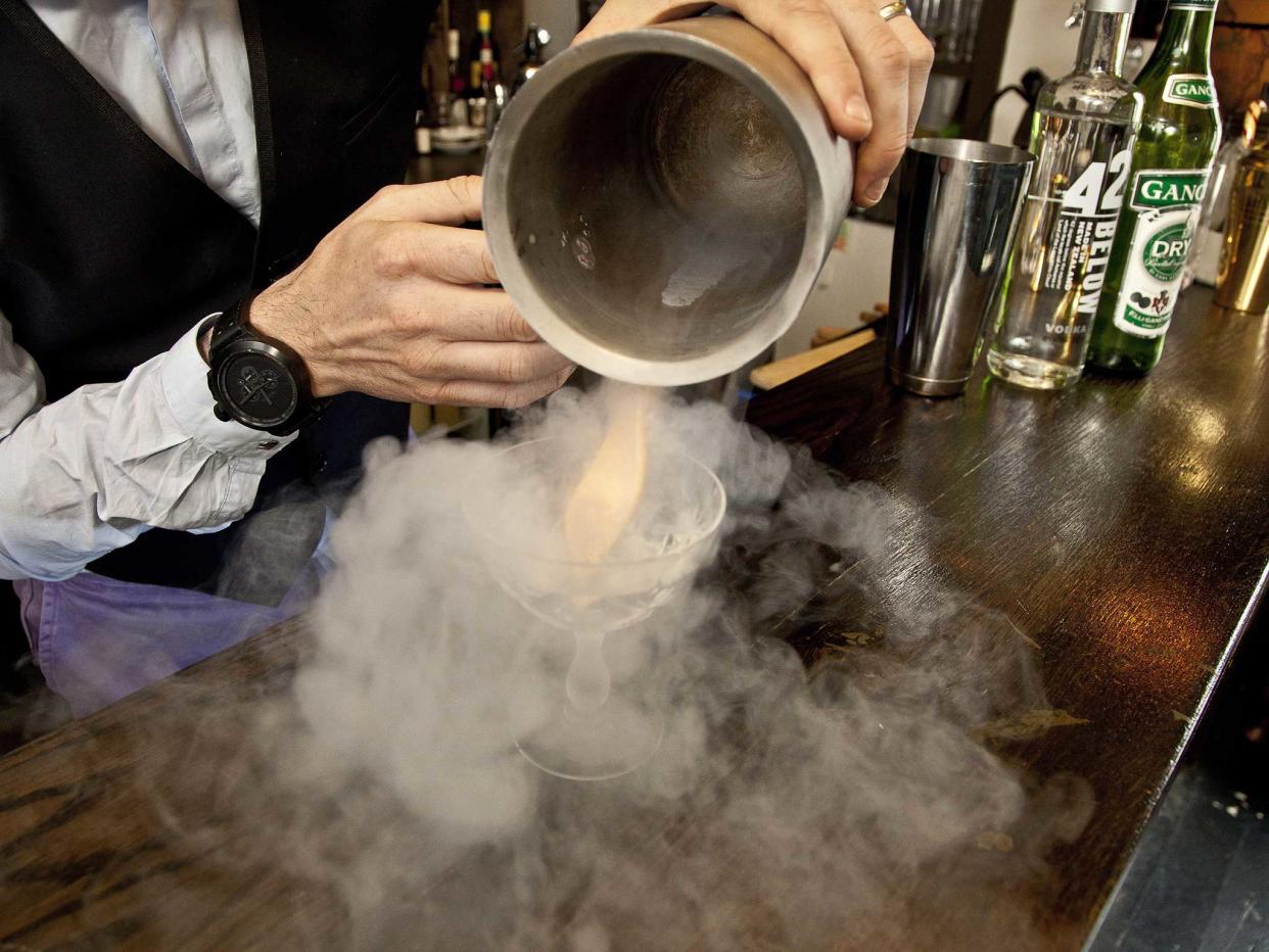 A cocktail is prepared using liquid nitrogen: Rex images