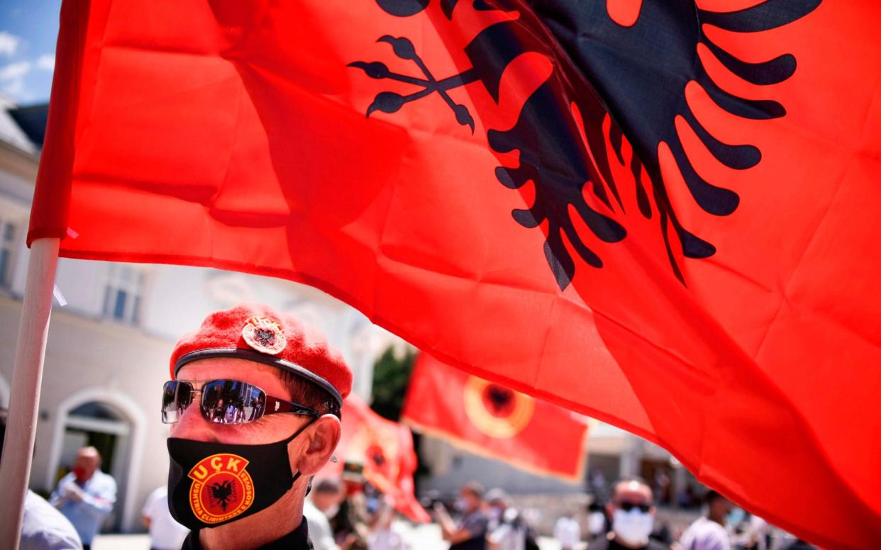 A Kosovo Liberation Army (KLA) veteran takes part in a protest against the indictments of former KLA members accused by the Hague of crimes against humanity  - AFP