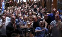 Leicester City fans react as their team scores a goal against Manchester United, as they watch the match in the Hogarth's pub in Leicester, Britain May 1, 2016 REUTERS/Eddie Keogh