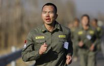 Blood drips from a student's nose as he takes part in a long-distance run during Tianjiao Special Guard/Security Consultant training on the outskirts of Beijing December 1, 2013. Former Chinese soldier Chen Yongqing has big ambitions for his bodyguard training school Tianjiao, which he says is China's first professional academy to train former soldiers and others as personal security guards. Chen charges 500,000 yuan ($82,400) a year for each protector as China's rich and famous look to bolster their safety and sense of importance. Picture taken December 1, 2013. REUTERS/Jason Lee (CHINA - Tags: BUSINESS SOCIETY) ATTENTION EDITORS: PICTURE 13 OF 26 FOR PACKAGE 'CHINA'S BODYGUARD SCHOOL' TO FIND ALL IMAGES SEARCH 'TIANJIAO'