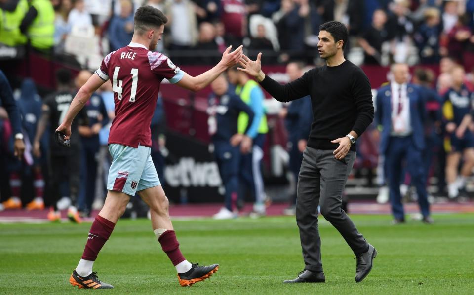 Mikel Arteta, Manager of Arsenal, and Declan Rice of West Ham United shake hands following the Premier League match between West Ham United and Arsenal FC at London Stadium - Getty Images/David Price