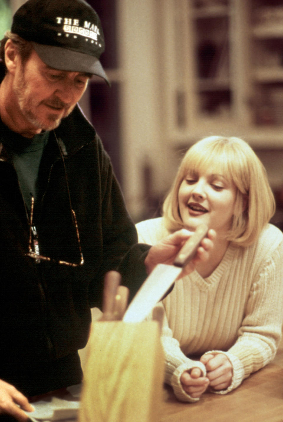 Drew Barrymore and Wes Craven on set, resetting a knife block