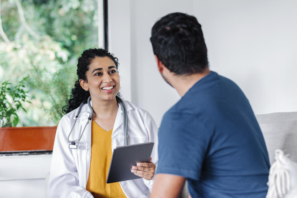 Man speaking to doctor. (Getty Images)