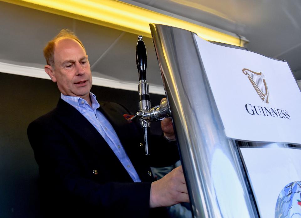 The Earl Wessex pours a pint of Guinness during a visit to Bangor, Northern Ireland (PA)