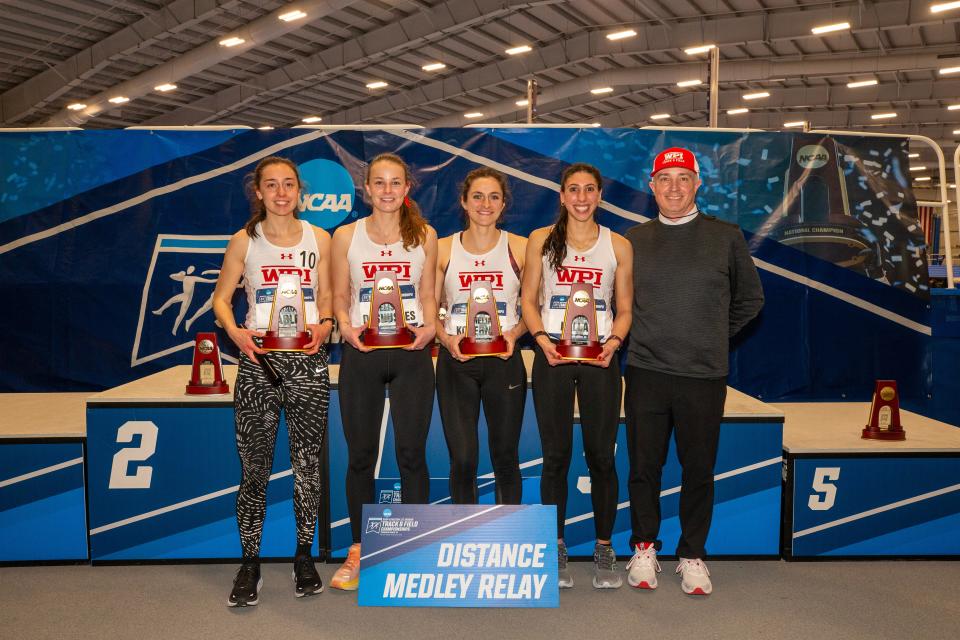 From left, Grace Hadley and WPI distance medley relay teammates Elise DeShusses, Amelia Kokernak and Isabel Hallal prevailed at the NCAA Division 3 Championships last weekend in Virginia Beach, Virginia. Proud coach Brian Chabot is at right.
