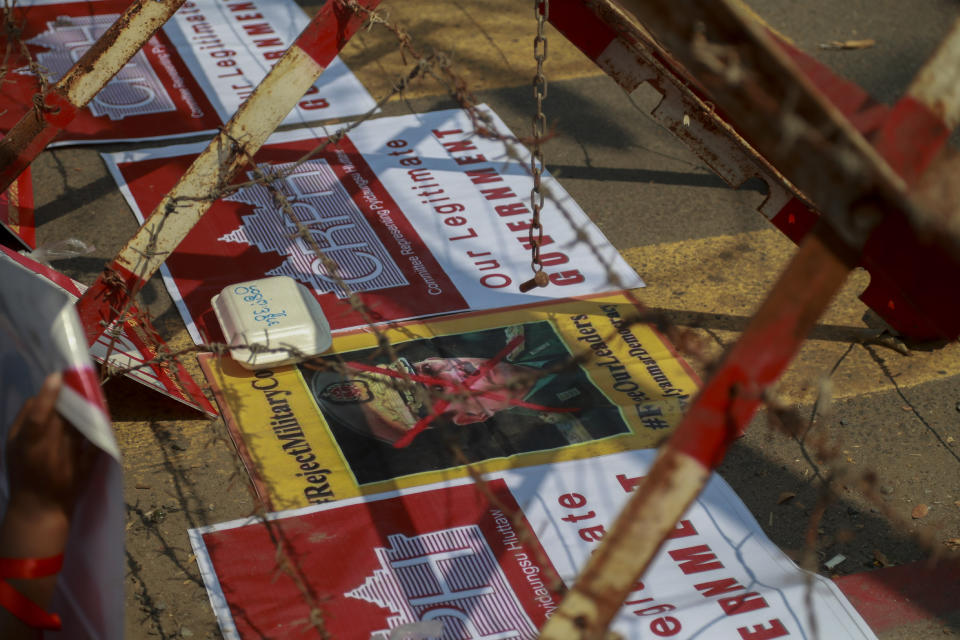 A defaced image of Commander in Chief, Senior General Min Aung Hlaing is placed under barricades near the Indonesian Embassy in Yangon, Myanmar Wednesday, Feb. 24, 2021. Anti-coup protesters gathered outside the Indonesian Embassy following reports that Indonesia was seeking to have fellow members of the Association of Southeast Asian Nations to agree on an action over the Myanmar's coup that would hold the junta to its promise to hold free and fair elections in a year's time. The Indonesia Foreign Ministry has denied the report. (AP Photo)