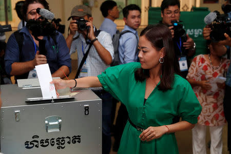 A woman votes during a general election in Takhmao, Kandal province, Cambodia July 29, 2018. REUTERS/Darren Whiteside