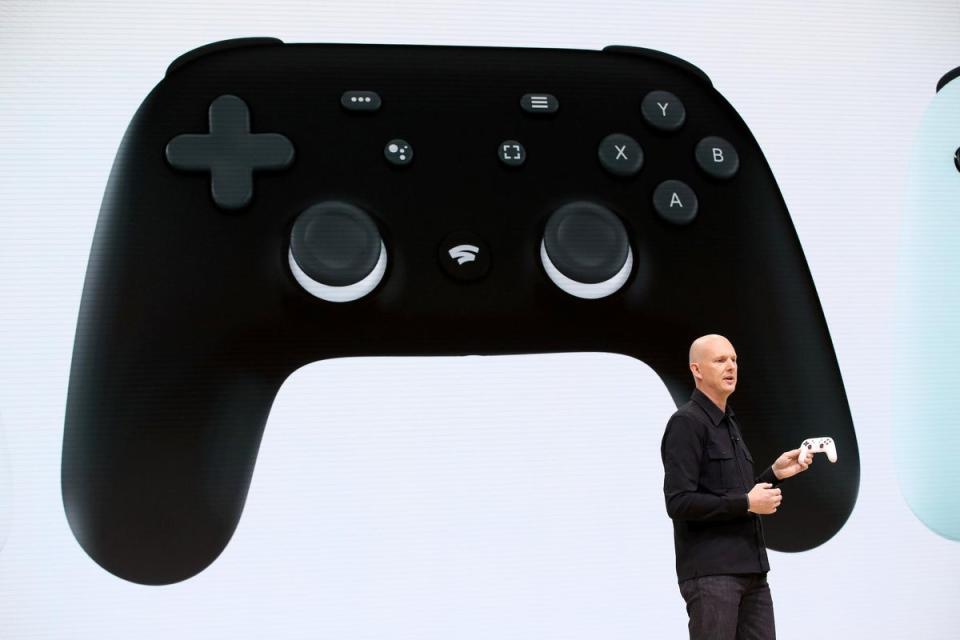 Google vice president and general manager Phil Harrison shows the new Stadia controller as he speaks during the GDC Game Developers Conference on March 19, 2019 (Justin Sullivan/Getty Images)