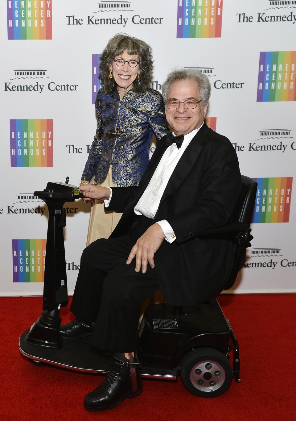 Israeli-American violinist and conductor Perlman and his wife pose as they arrive at the U.S. State Department for a gala dinner in Washington