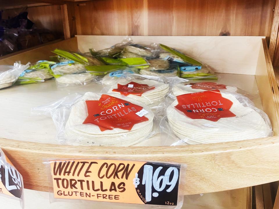 Clear plastic packages of Trader Joe's corn tortillas with orange star-shaped labels on them