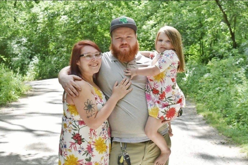 Dusty Lawrence with his wife, Betsy, and daughter, Madyson.