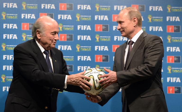 Vladimir Putin has slammed the arrests of top FIFA delegates in a US probe as an attempt by Washington to oust Sepp Blatter as head of the organisation