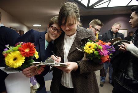 Natalie Dicou (L) and her partner Nicole Christensen wait to get married at the Salt Lake County Clerks office in Salt Lake City, Utah, December 20, 2013. REUTERS/Jim Urquhart