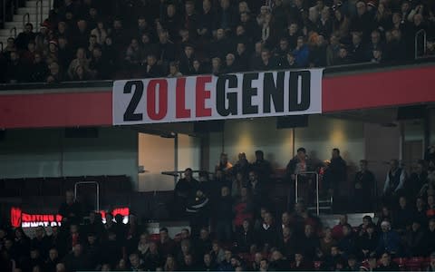 Ole Gunnar Solskjaer banner during Manchester United vs Huddersfield Town - Credit: Gareth Copley/Getty Images