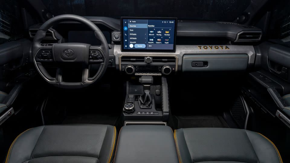 The Toyota 4Runner's interior features the brand name in chunky block letters. - Toyota