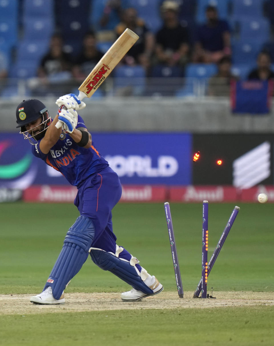 India's Virat Kohli is bowled out by Sri Lanka's Dilshan Madushanka during the T20 cricket match of Asia Cup between Sri Lanka and India, in Dubai, United Arab Emirates, Tuesday, Sept. 6, 2022. (AP Photo/Anjum Naveed)