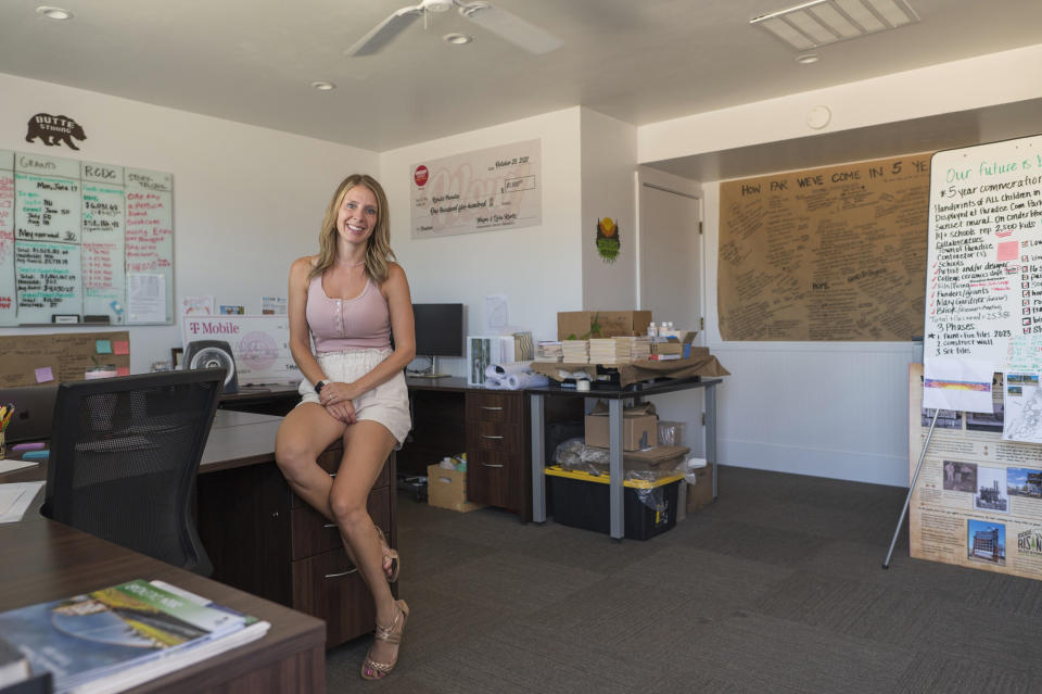 Jen Goodlin, executive director of the Rebuild Paradise Foundation, sits in her office in Paradise, Calif., Friday, June 14, 2024. The foundation was just winding down its largest grant program when, right before the five-year anniversary of the fire, insurance companies began raising premiums and dropping customers. (AP Photo/Nic Coury)