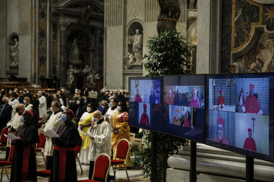 Cardinals who could not preside due to COVID-19 attends via video connection a consistory ceremony where 13 bishops were elevated to a cardinal's rank in St. Peter’s Basilica at the Vatican, Saturday, Nov. 28, 2020. (Fabio Frustaci/POOL via AP)