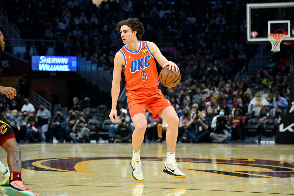 Josh Giddey (pictured) drives to the basket during an NBA game.