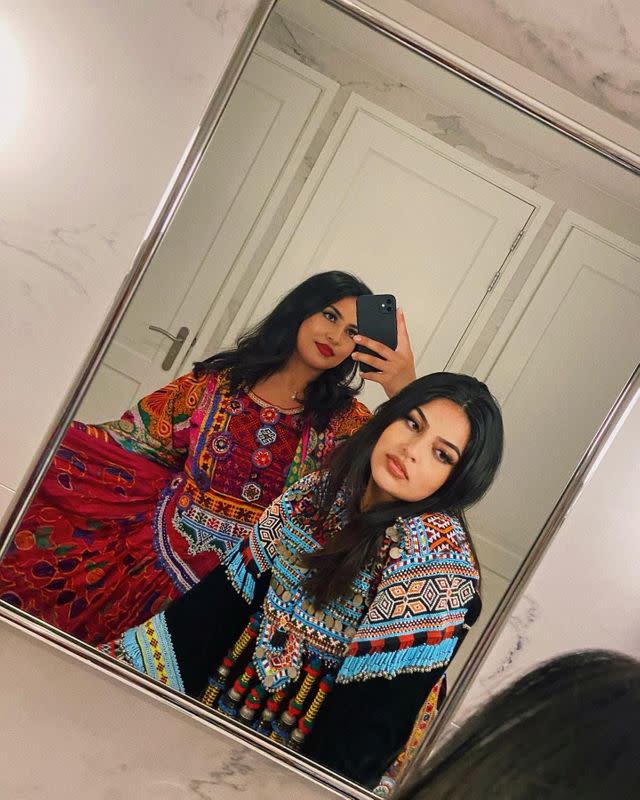 Women pose in traditional Afghan attire, in Rotterdam