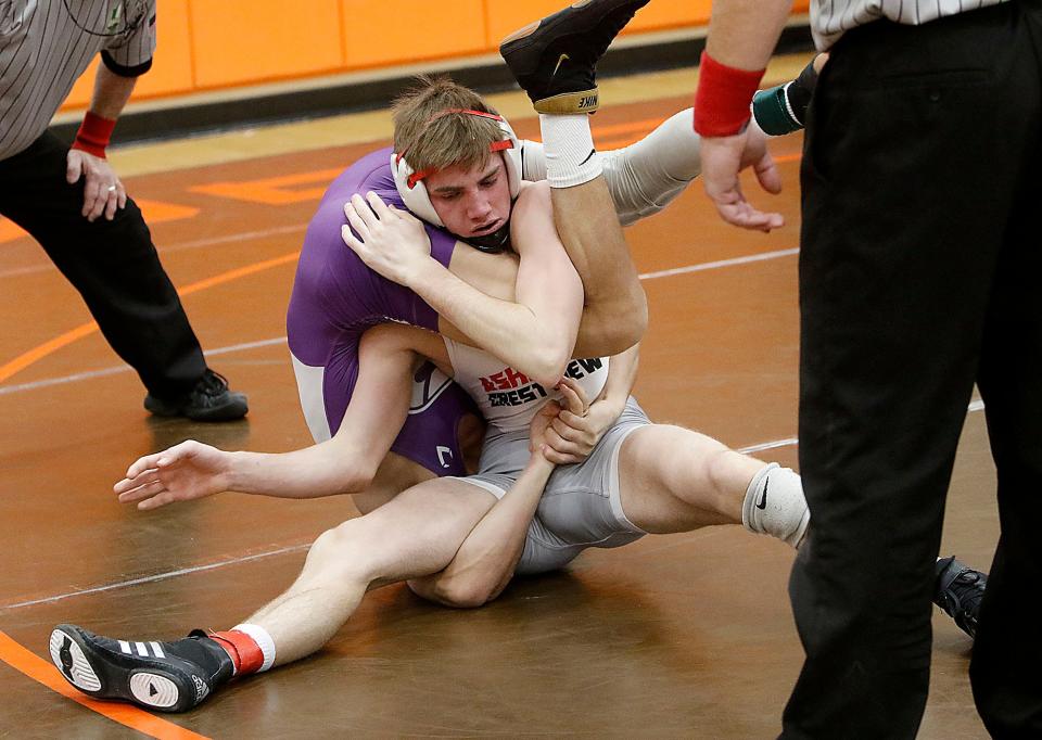 Crestview High School's Hayden Kuhn wrestles Clear Fork's Jaxon Swank during the JC Gorman Invitational Saturday, Jan. 8, 2022 Mansfield Senior High School. TOM E. PUSKAR/TIMES-GAZETTE.COM