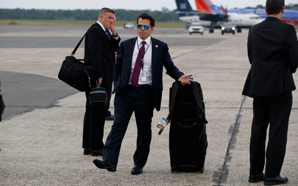 Anthony Scaramucci stands on the tarmac after arriving at Long Island MacArthur Airport in Ronkonkoma, New York - Credit: AP