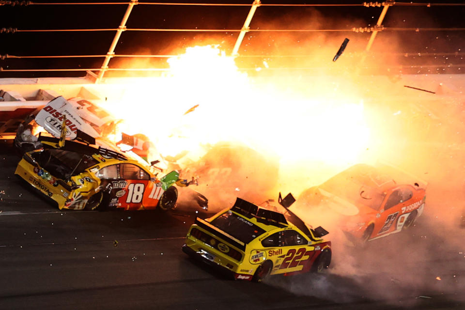 DAYTONA BEACH, FLORIDA - FEBRUARY 14: Brad Keselowski, driver of the #2 Discount Tire Ford, Kyle Busch, driver of the #18 M&M's Toyota, Joey Logano, driver of the #22 Shell Pennzoil Ford, and Bubba Wallace, driver of the #23 DoorDash Toyota, are involved in an on-track incident during the NASCAR Cup Series 63rd Annual Daytona 500 at Daytona International Speedway on February 14, 2021 in Daytona Beach, Florida. (Photo by James Gilbert/Getty Images)