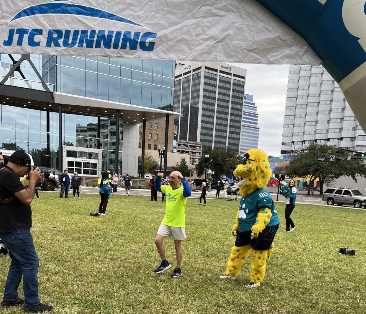 Mike Freed completes his sixth marathon in six days Saturday outside the Duval County Courthouse for the Freed to Run fundraiser for Jacksonville Area Legal Aid.