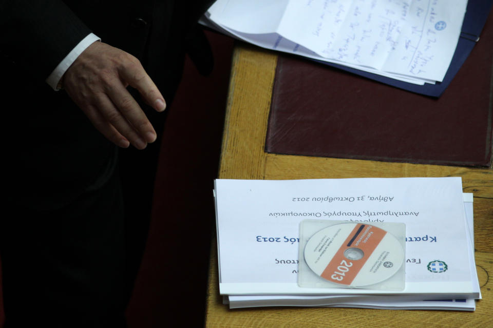 The new draft state budget for 2013 is seen on a desk at the Greek parliament in Athens, Wednesday, Oct. 31, 2012. Greek lawmakers are to vote Wednesday on a privatization bill that will be the first major test for the country's troubled governing coalition, while journalists have walked off the job at the start of rolling 24-hour strikes to protest austerity plans that will affect their healthcare funds. (AP Photo/Thanassis Stavrakis)